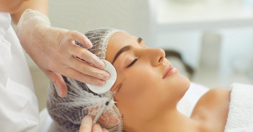 Woman receiving dermal fillers. Not a real patient.